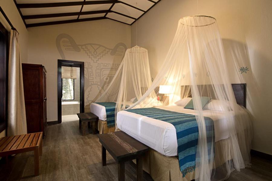 Hotel Jungle Lodge Тикаль Экстерьер фото